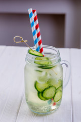 Fresh cold cocktail with cucumbers in misted glass. Non-alcoholic summer lemonade. Vegetarian menu of cafe or restaurant