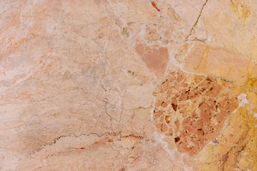 marble texture affected by long use. The wall of the underground storage of red color.