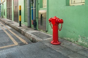 Red hydrant booster, fire hydrant on the street