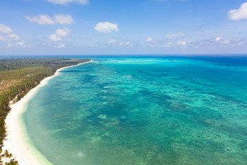 Large tropical island white sandy beach, view from above. Seascape, nature of the Philippine Islands. Tropical forest and sea lagoons.