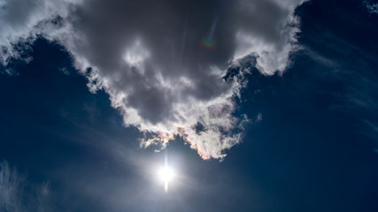 white clouds float across the blue sky