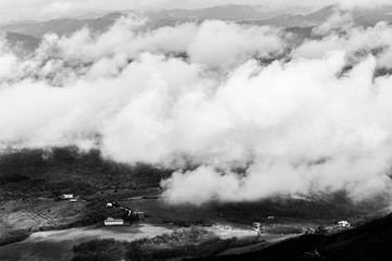 View from above of Umbria valley, with clouds below the viewer