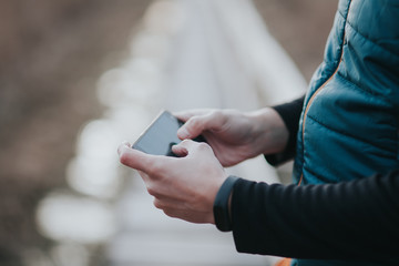 Handsome young influencer man using a smartphone