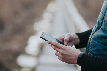 Handsome young influencer man using a smartphone