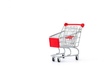 Empty shopping cart on white background. Close-up of shopping trolley on with some copy space....