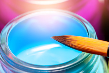 bottles poster color and paintbrush  on a white background Isolated Paints in containers