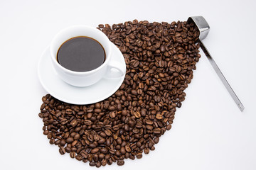 white cup of coffee with coffee bean and spoon on white background