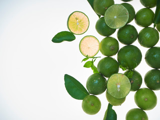 Lime and leaves isolated on a white background