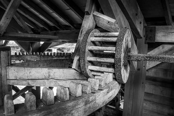 Wooden pin and cog mechanism from a cider mill