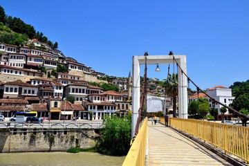 The albanian ancient city of Berat, designated a UNESCO World Heritage Site in 2008. Old stone houses at district of Mangalem and pedestrian bridge in Berat