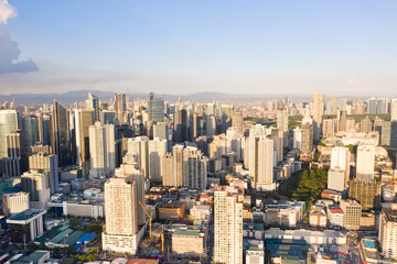 Obraz premium Modern city. The city of Manila, the capital of the Philippines. Modern metropolis in the morning, top view. Modern buildings in the city center.