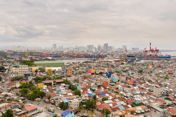 Cityscape Manila. Residential areas and business center in the city, top view. Big port city. The capital of the Philippines.