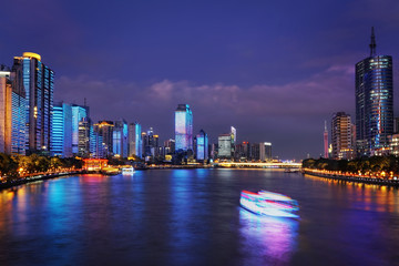  Guangzhou city skyline and Pearl River in blue hour.     