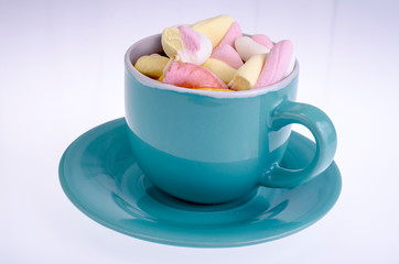 Cocoa drink with marshmallows on white background
