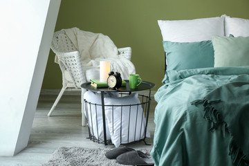 Big comfortable bed in stylish interior of room