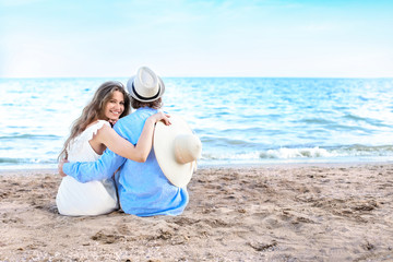 Fototapeta na wymiar Happy young couple at sea resort