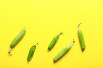 Tasty fresh peas on color background