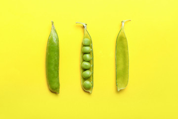 Tasty fresh peas on color background
