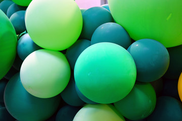 Colorful green and multicolor balloons at a party