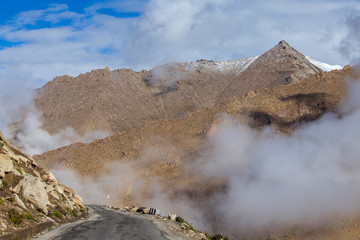 View of winding road and majestic rocky mountains in Indian Himalayas, Ladakh, India. Nature and travel concept
