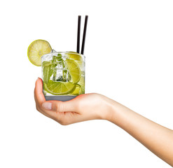 Woman hand holding cocktail in old fashioned glass with black straw