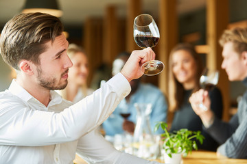 Man with wineglass at a wine tasting
