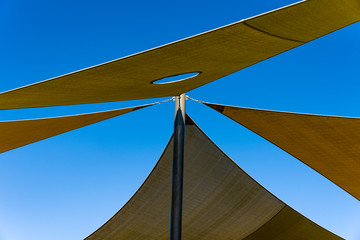 Shade Sail Color brown roof from the sun on the playground boat, coast,