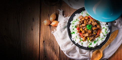 Tajin beef stew with rice paprika and sesame seeds