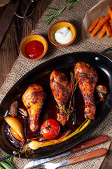 grilled chicken legs in barbecue marinade with sweet potatoes