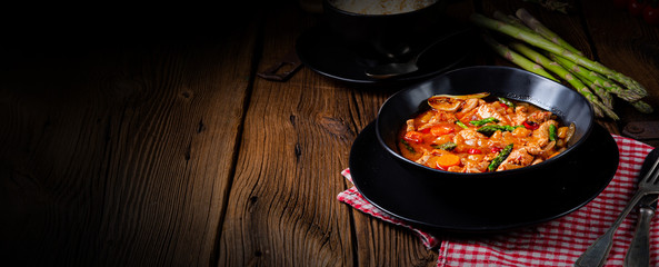 colorful turkey fricassee with asparagus and paprika