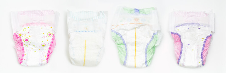 Set of Disposable Baby Diapers Over White Background - obrazy, fototapety, plakaty