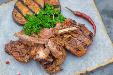 Grilled rack of lamb with eggplant and parsley