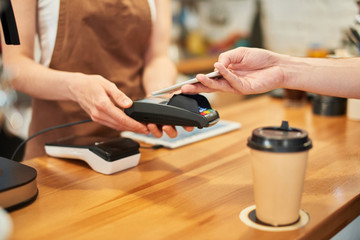 Barista recieves online payment from a client.