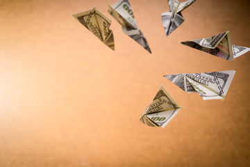 A floating folded paper planes origami made by USD notes/bills