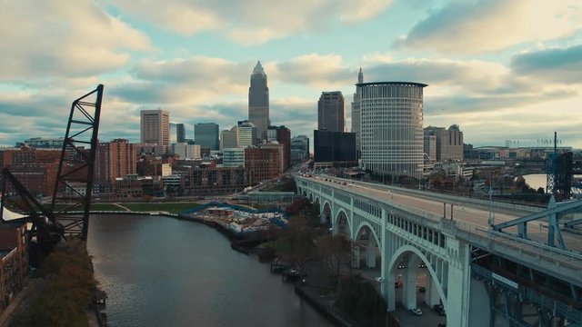 Aerial Drone forward dolly shot of downtown Cleveland Ohio from over the Cuyahoga River in The Flats