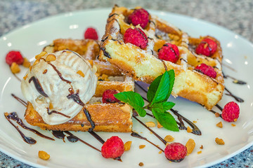 delicious belgian waffles with fruit and ice cream