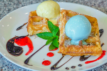delicious belgian waffles with fruit and ice cream