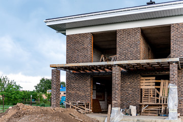 Roofing Construction and Building New Brick House with Modular Chimney, Skylights, Attic, Dormers and Eaves.