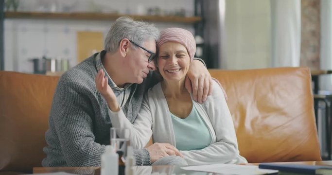 Joyful breast cancer survivor and her husband