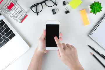 Top view of women using mobile phones for online shopping. Concept technology.