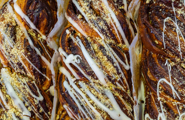 Sugar icing on chocolate cakes at street market bakery