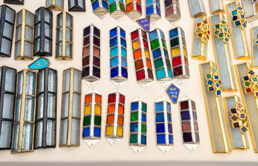 Handmade glass colorful cases for mezuzah sold at handicraft market. Tel-Aviv