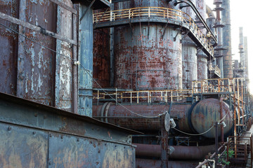 Naklejka premium Perspective view of industrial facility with stacks and pipes, horizontal aspect