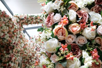 Selective focus of beautiful bouquet of mixed flowers on blurred flowers as a background, Valentine day, Love concept, Wedding decoration