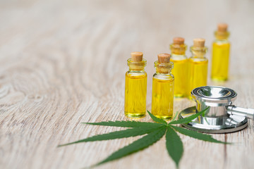 Obraz na płótnie Canvas Hemp oil, Marijuana oil bottle, cannabis oil extracts in jars, medical marijuana, CBD oil pipette.