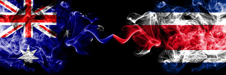 Australia vs Costa Rica smoky mystic flags placed side by side. Thick colored silky smokes combination of national flags of Australia and Costa Rica