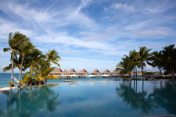 The pool under palm trees on the seashore.Polynesia, Tahiti