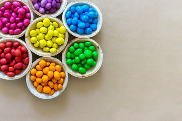 Colorful Rainbow Chocolate Candy on Carton Background