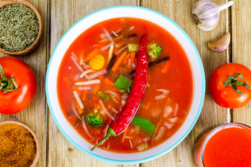 Spicy tomato vegetable soup, top view