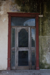 old wooden door in stone wall